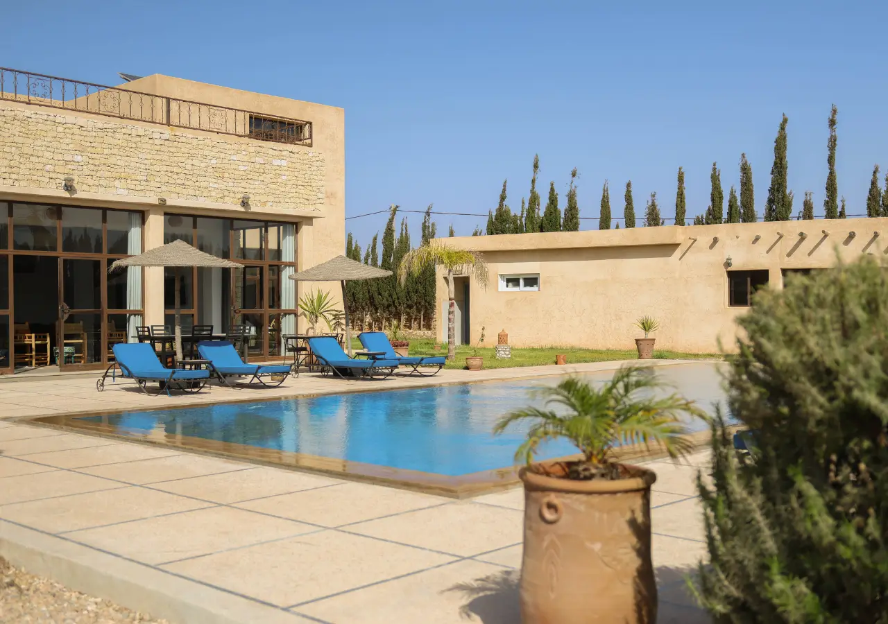 Dar Ayman pool and warm stone guesthouse in daylight